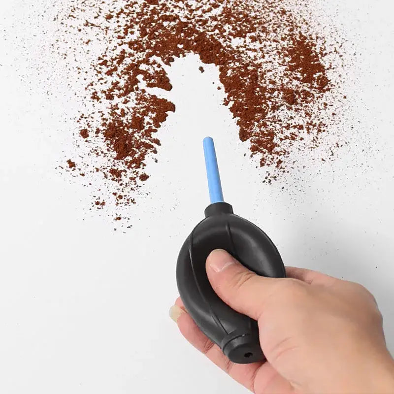 Black rubber blower with blue nozzle for cleaning brush set designed to remove dust from coffee grinders and electronics
