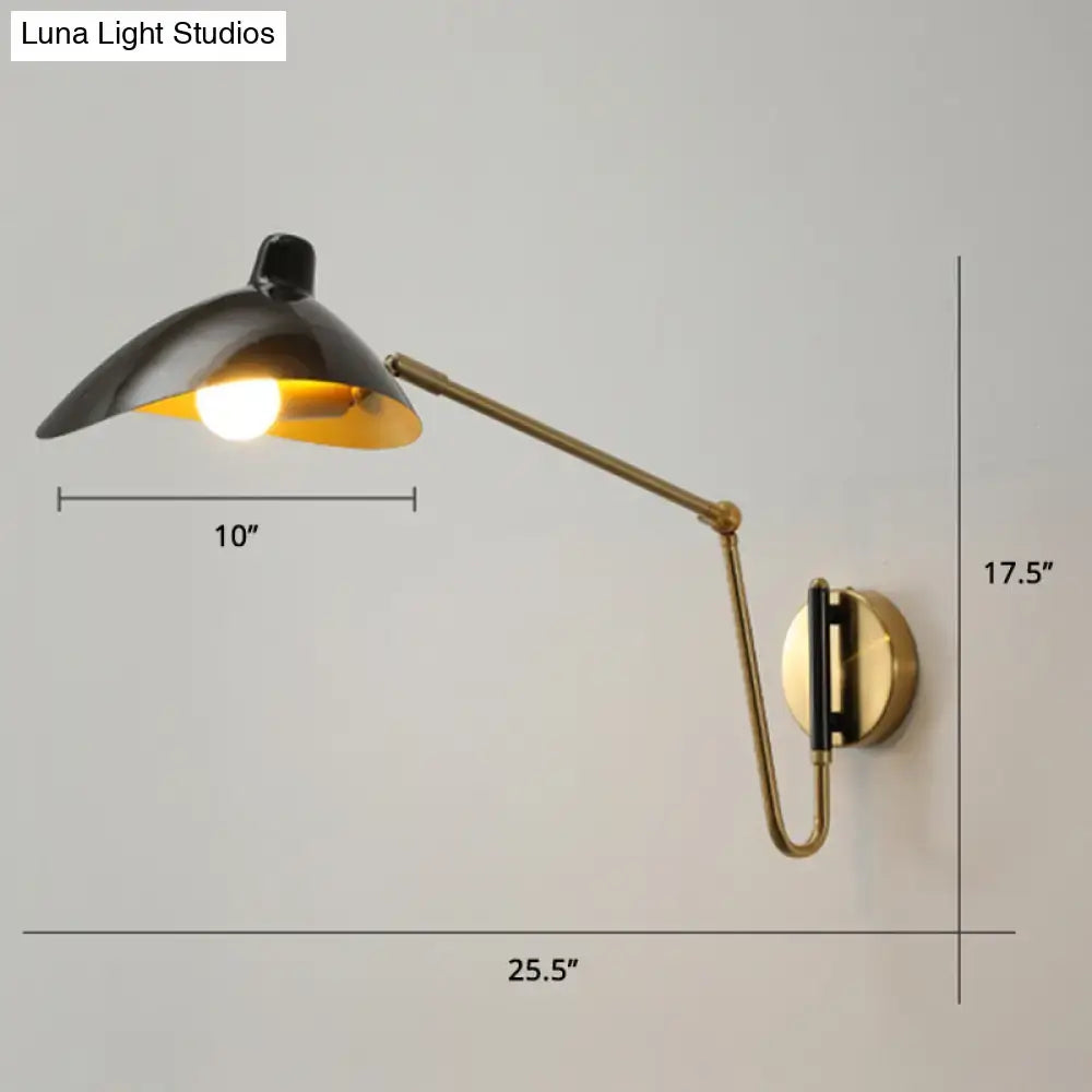 Black and brass duckbill reading light wall lamp with adjustable joint and sleek modern design for bedroom use