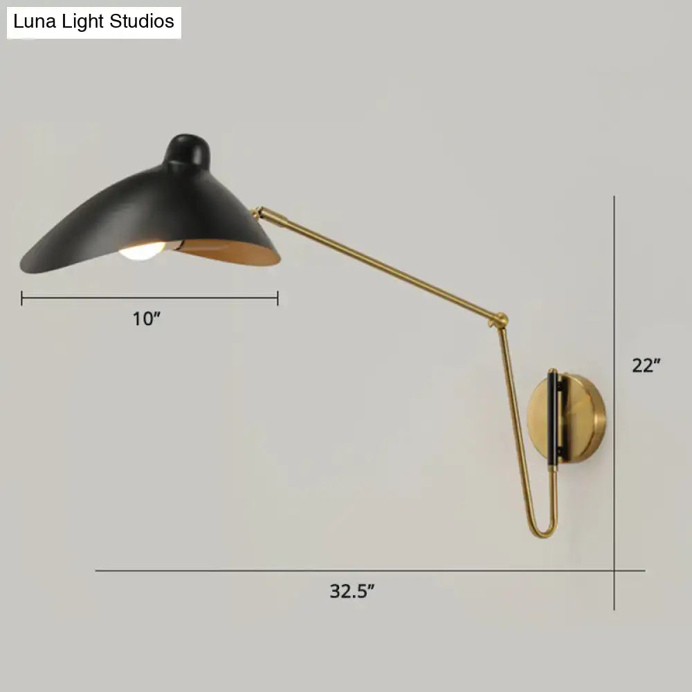 Black and brass duckbill reading light wall lamp with adjustable joint and sleek modern design for bedroom use