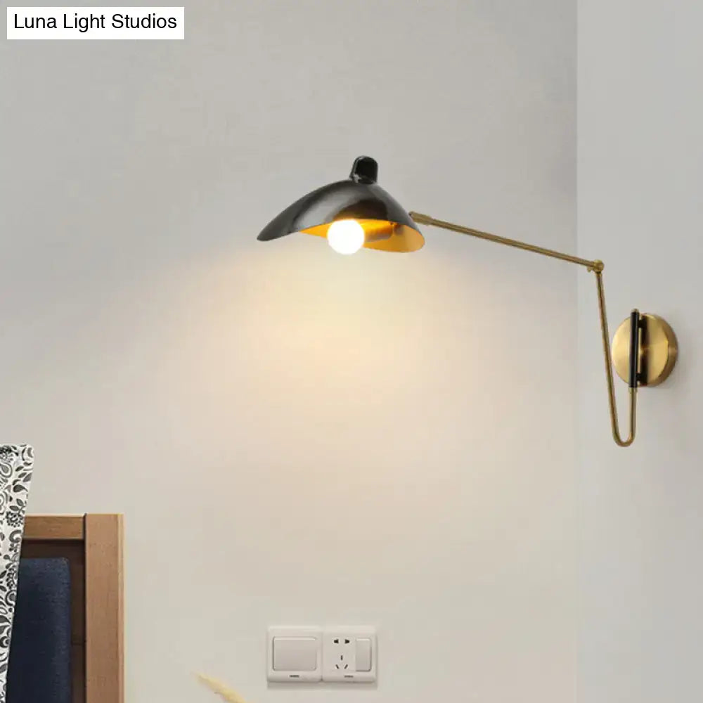 Black and brass wall lamp with adjustable joint and duckbill reading light for modern bedroom use