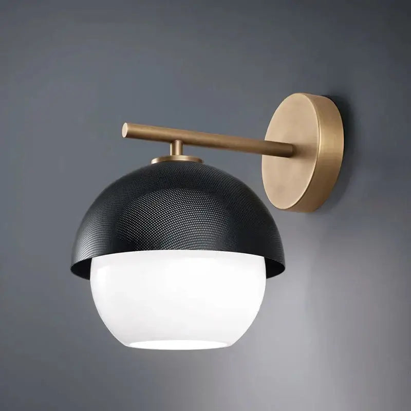 Black and brass mesh globe wall lamp with white frosted glass globe and decorbites black metal arm for bedroom luxury decor