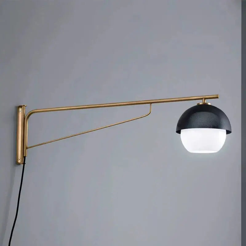 Modern wall lamp with brass-finished black metal arm and black textured dome shade for luxury bedroom decorbites decor