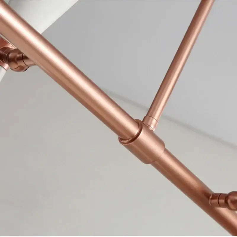Black and brass nordic led multiple head chandelier with copper pipe intersecting rods and polished joints for living room