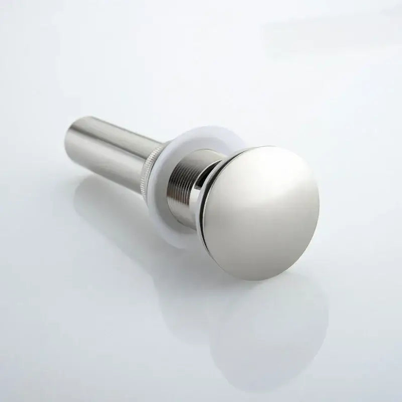 Shiny chrome-finished bathroom sink drain with brushed nickel stopper and threaded metal body for decorbites brushed nickel faucet