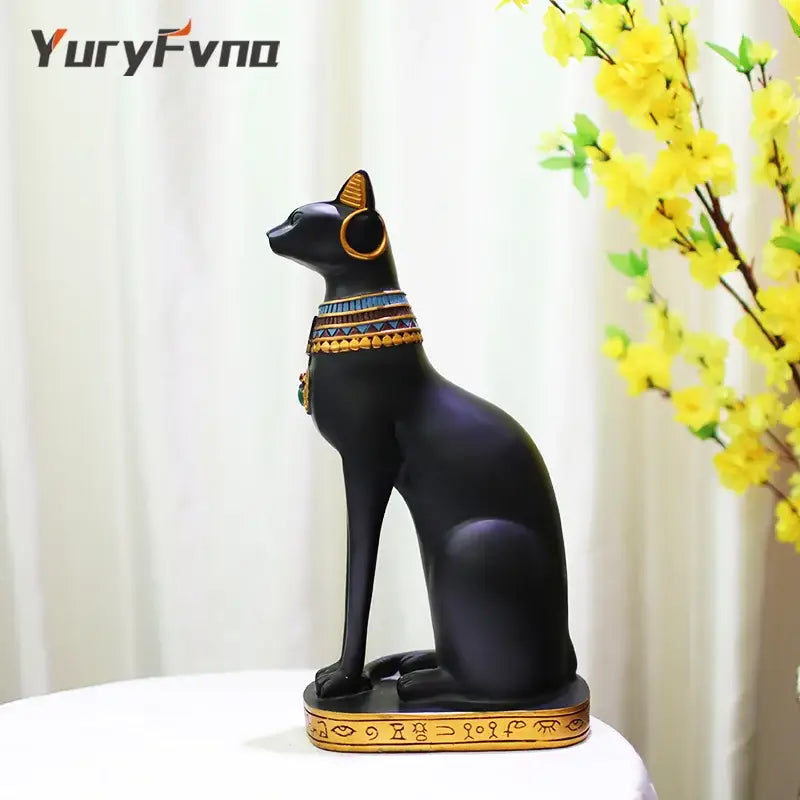 Black resin bastet cat goddess statue with gold and blue collar and base for living room decor by decorbites