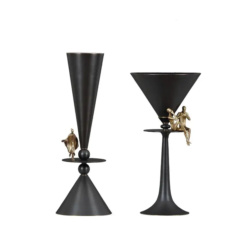 Black matte decorative wine glasses with gold-toned decorbites bronze flower figures on stems for cocktail use