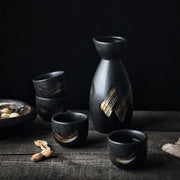 Black ceramic sake liquor dispenser set with gold brushstroke accents decorbites ceramic sake for dining room use