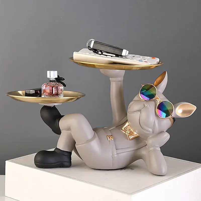 Gray resin decorbites bulldog animal figurine wearing gold bow tie and sunglasses reclining with black and gold trays