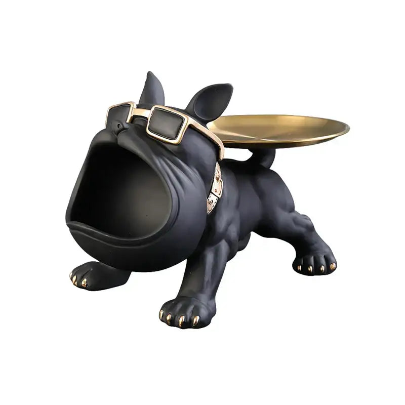 Black and gold french bulldog figurine with brass tray and gold collar for remote control storage in living room
