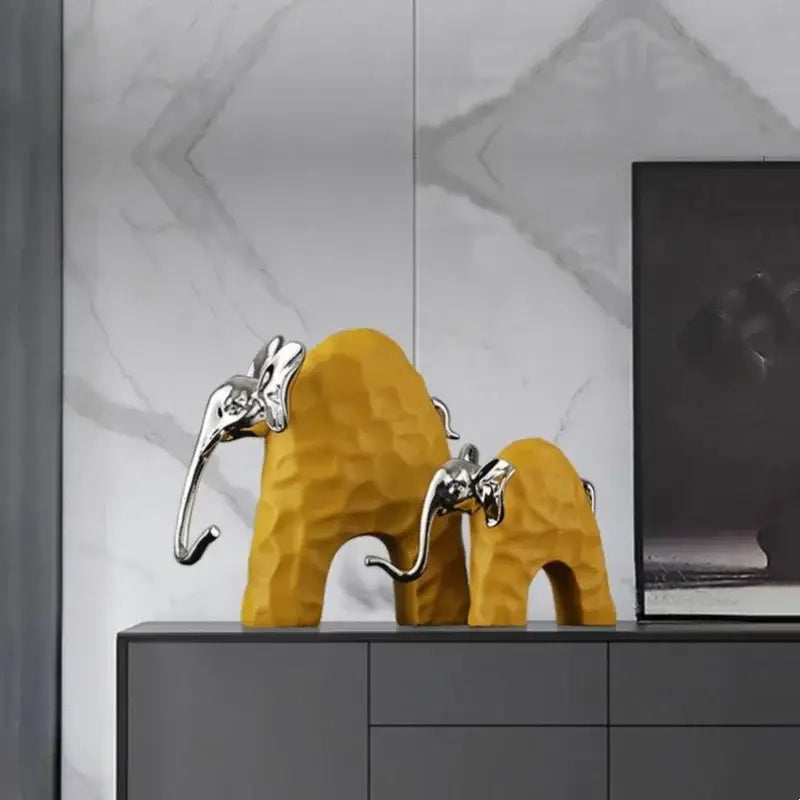 Black and gold decorbites elephant mother-calf golden resin sculpture with textured bodies and polished silver trunks for living room decor