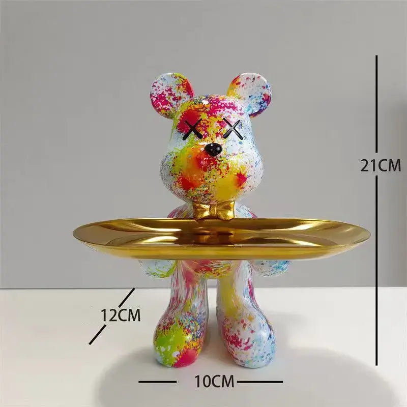 Black and gold graffiti bear figurine with colorful splatter paint x’d eyes and gold bow tie holding a shiny tray decorbites bear figurine