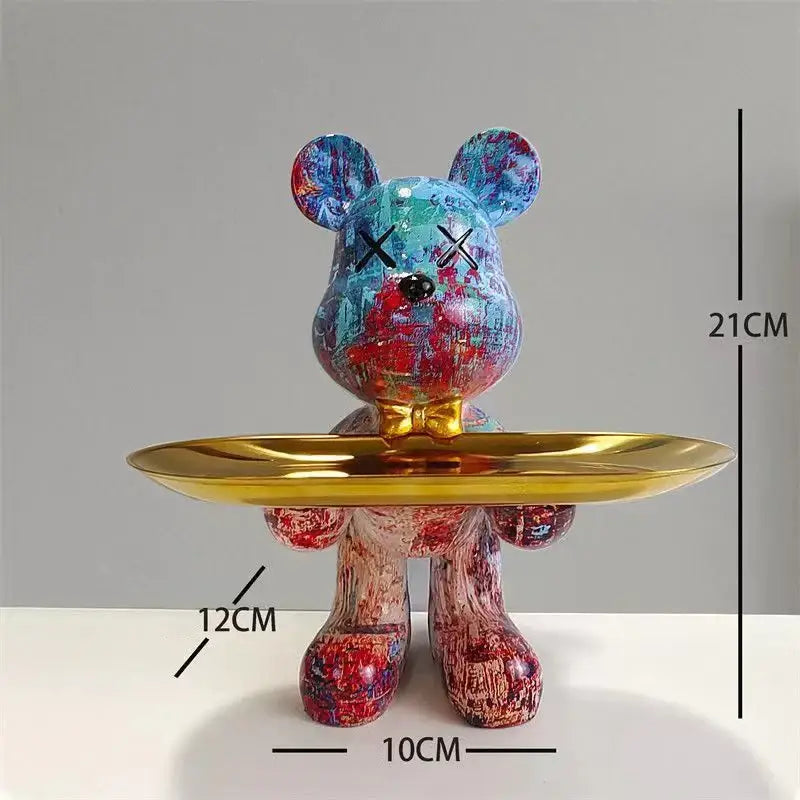 Black and gold graffiti bear figurine decorbites holding a shiny tray with x-shaped eyes for living room decor