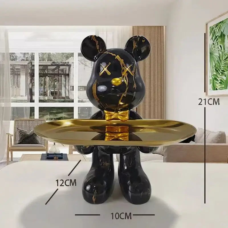 Black and gold graffiti bear figurine with glossy finish holding a shiny gold tray for living room decorbites decor