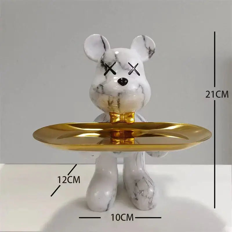 Marble-finish black and gold graffiti bear figurine with black x eyes and a gold bow tie holding a golden tray decorbites