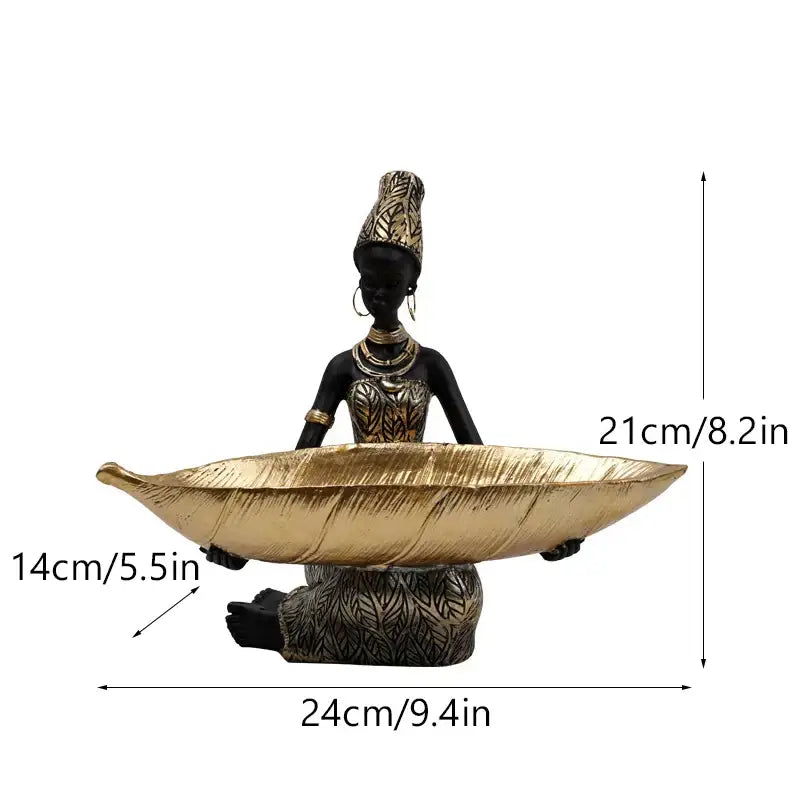 Black woman resin figurine with black and gold attire holding a golden leaf tray for living room decorbites black woman