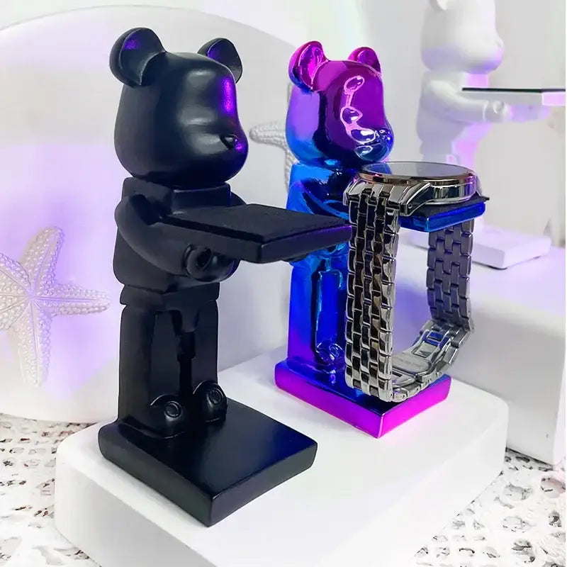 Black and iridescent purple cartoon bear watch stands with sleek glossy resin finish for bedroom decor