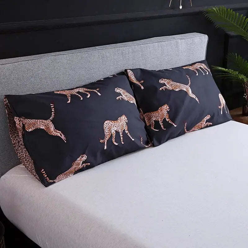 Black pillowcases with gold-toned cheetah pattern as part of black and rose gold leopard print duvet set decorbites Leopard Print
