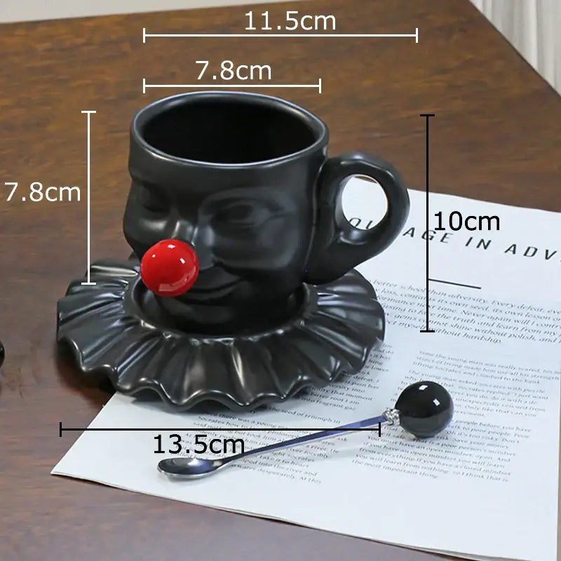 Black ceramic joker head cup with red nose and ruffled collar on silver saucer porcelain coffee set decorbites joker head