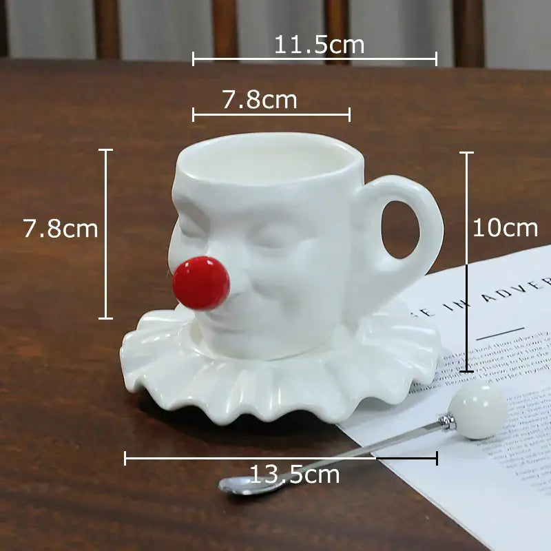 White ceramic decorbites joker head cup with red nose and ruffled black and silver saucer porcelain coffee set