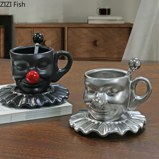 Black and silver joker head cup and saucer porcelain coffee set with clown-faced design and distinct red and metallic noses