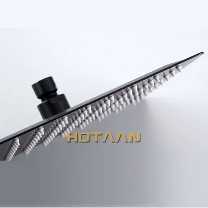 Black and silver stainless steel shower head with sleek modern design and decorbites black plated finish