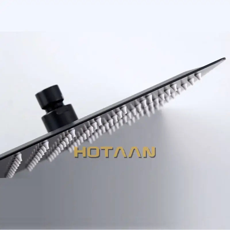 Black and silver stainless steel shower head with sleek modern design and decorbites black plated finish