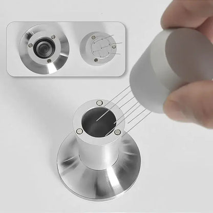 Silver metallic doorbell camera with circular lens featured alongside black and stainless steel decorbites coffee distributor tamper set