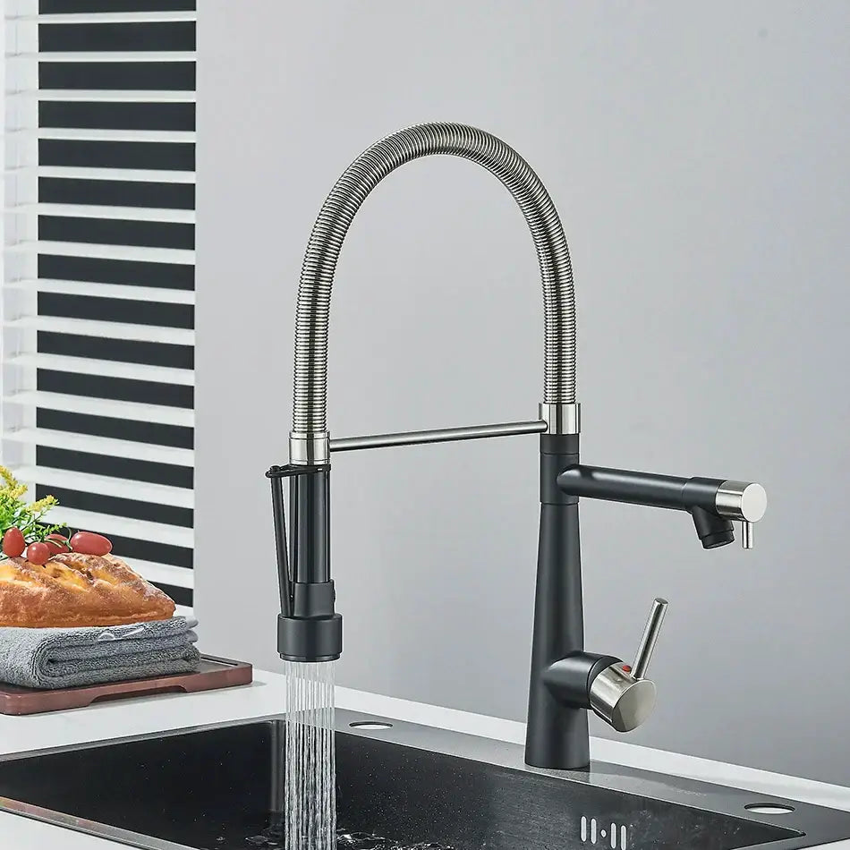 Black and stainless steel kitchen faucet with flexible ribbed gooseneck spout and pull-down spray head by decorbites brass pull
