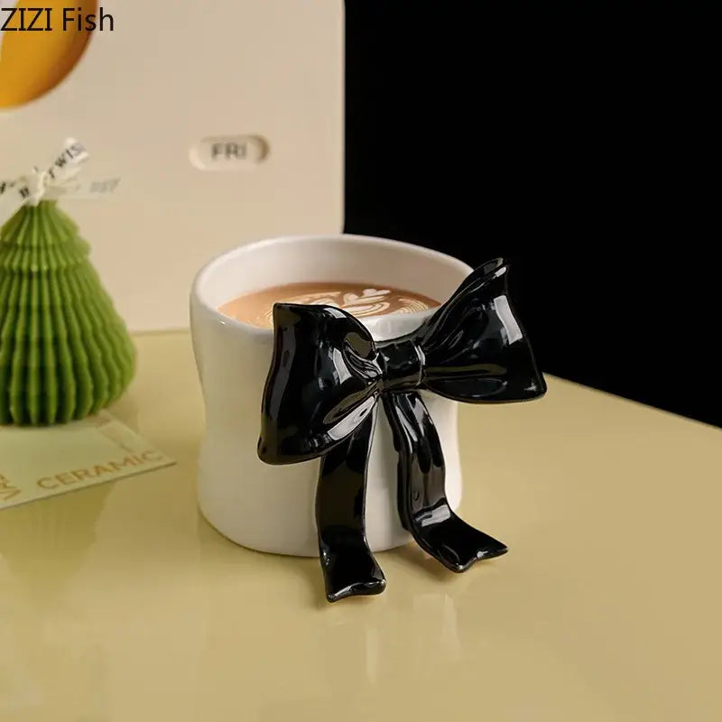 White porcelain coffee cup with a glossy black bowknot designed for dining room use