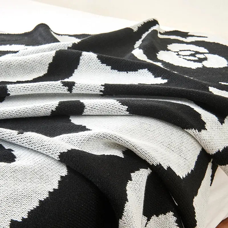 Black and white camellia knitted blanket with bold floral pattern ideal for living room decorbites camellia knitted throw