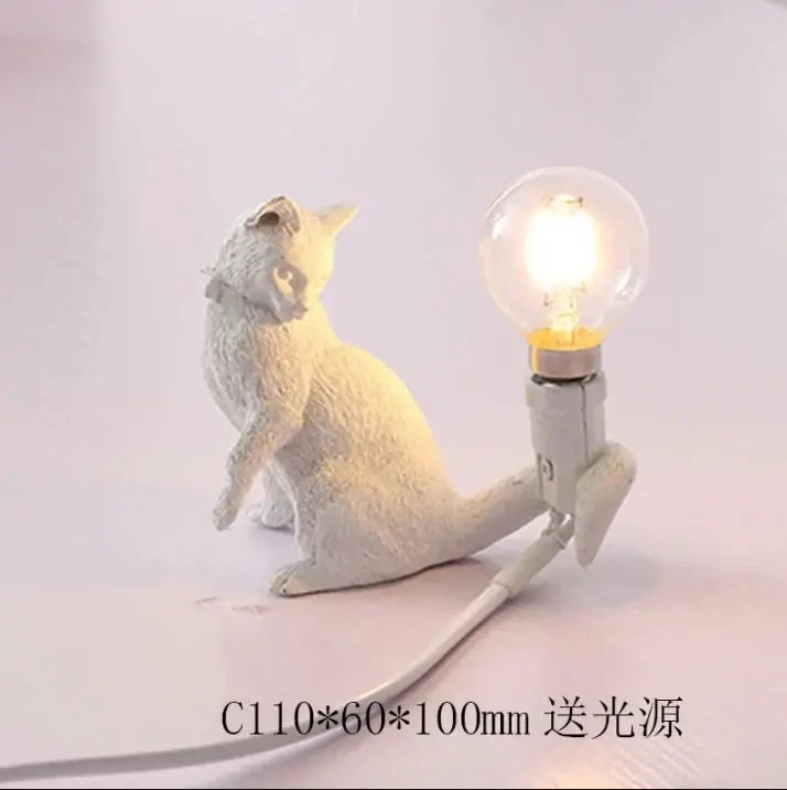 White ceramic cat resin table lamp with glowing bulb on back for bedroom decorbites cat resin decor