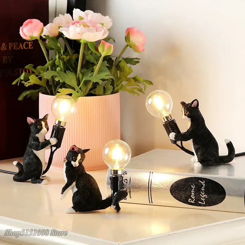 Black and white cat resin table lamp featuring figurines holding illuminated bulbs for bedroom decorbites cat resin decor