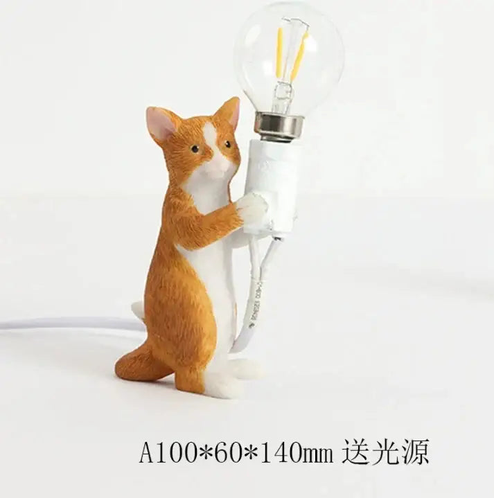 Orange and white cat resin table lamp holding a clear glass bulb decorative for decorbites cat resin bedroom decor