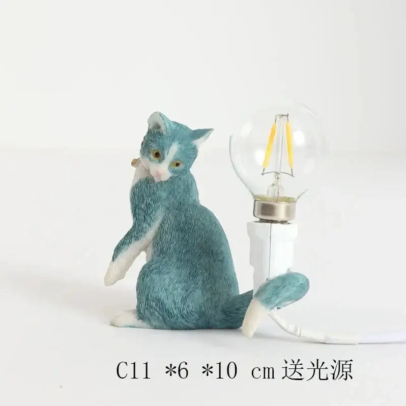 Black and white cat resin table lamp with teal and white textured cat figurine and clear glass bulb base decorbites cat resin