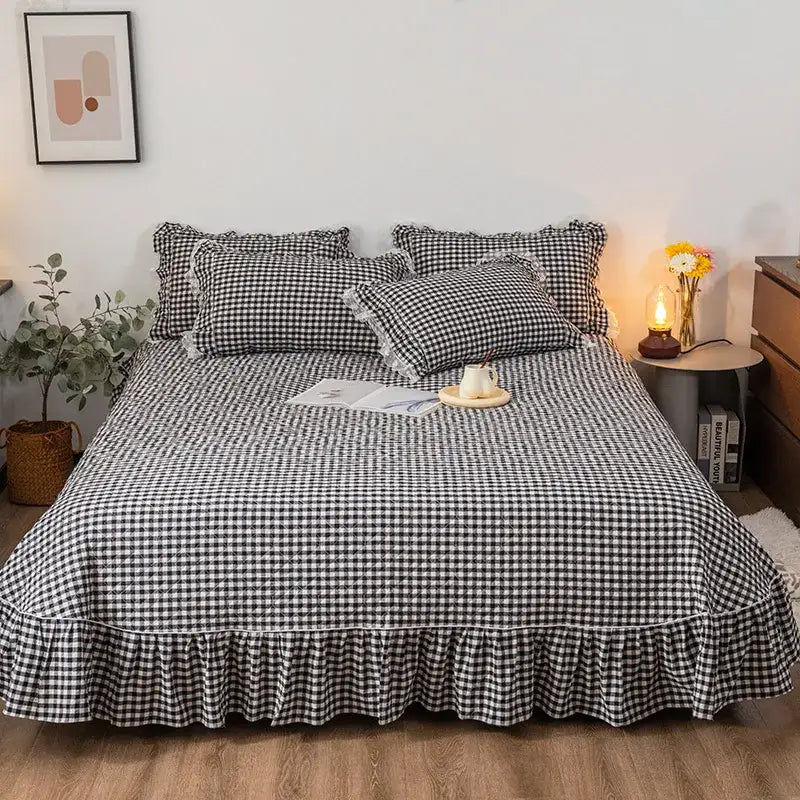 Black and white cotton plaid stripe bedding set featuring a checkered bedspread with a ruffled hem by decorbites