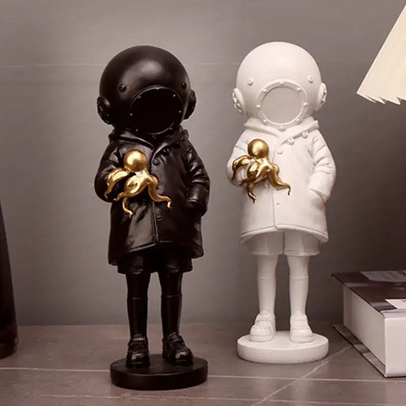 Black and white diver girl resin statues holding golden octopus ideal for living room octopus decor