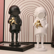 Black and white diver girl resin statue holding golden octopus ideal for living room octopus decor display