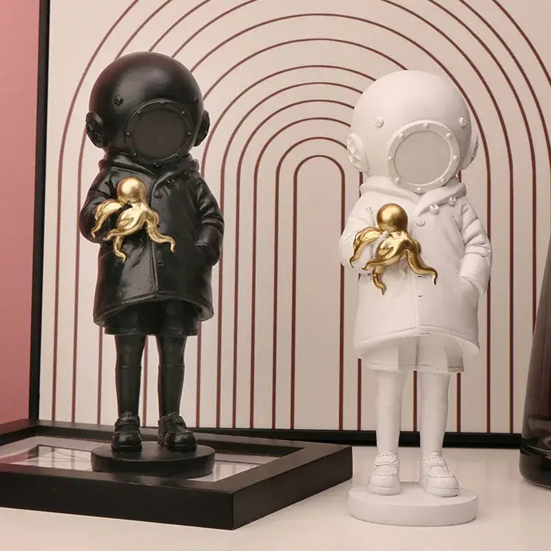 Black and white diver girl resin statue holding golden octopus ideal for living room octopus decor display