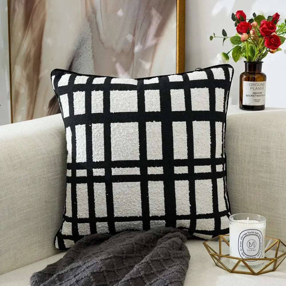 Black and white geometric chenille pillow cover with textured grid pattern for living room decor by decorbites