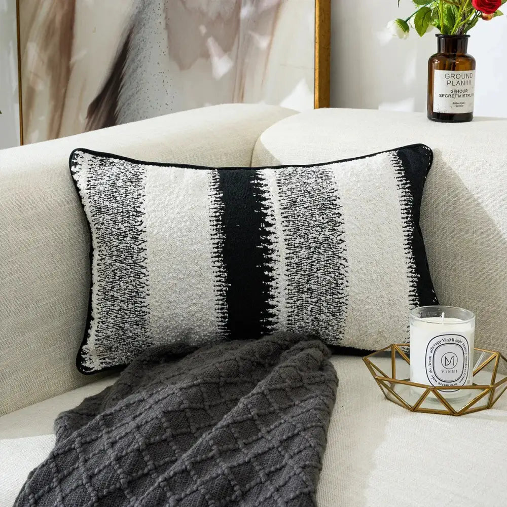 Black and white geometric chenille pillow cover with knitted striped pattern on beige sofa for living room decorbites decor