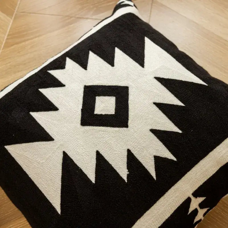 Black and white geometric embroidered cushion cover with bold symmetrical angular design for living room decorbites decor