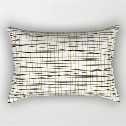 Rectangular pillow with a black and white geometric wave line design featuring intersecting black and gold lines