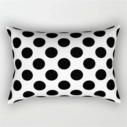 Rectangular pillow with bold black and white polka dot pattern in a geometric wave line pillowcase set for bedroom decor