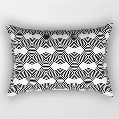 Rectangular pillow with bold black and white geometric wave line pattern of overlapping hexagons for bedroom decor