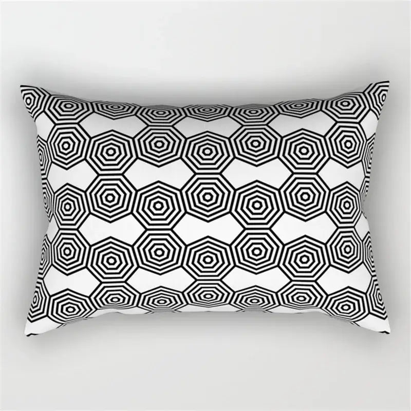 Rectangular pillow with bold black and white geometric wave line pattern of overlapping hexagons for bedroom decor