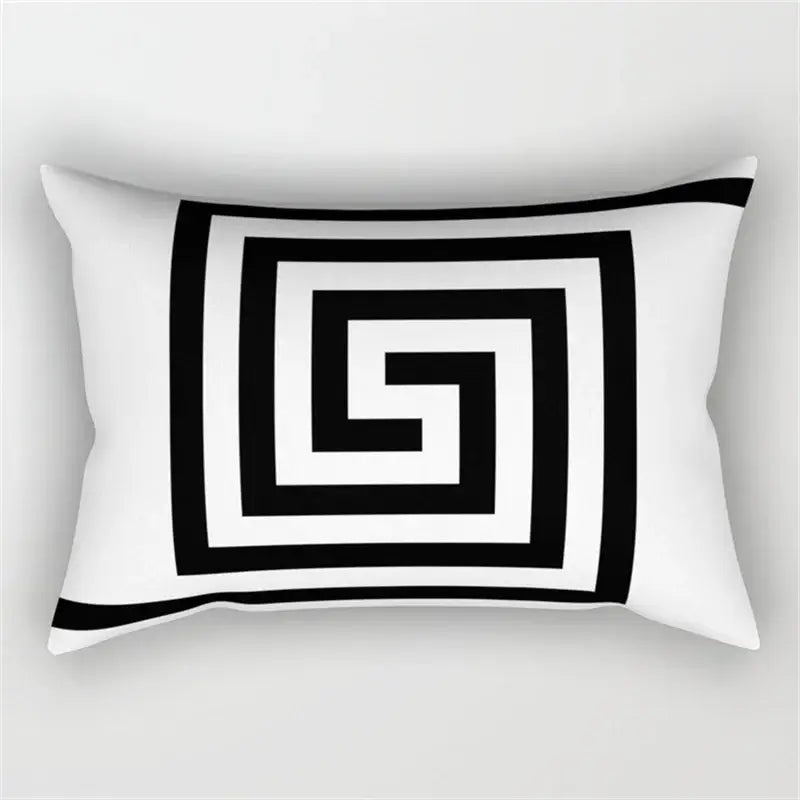 White rectangular pillow with bold black greek key pattern featuring geometric wave line design for bedroom decor