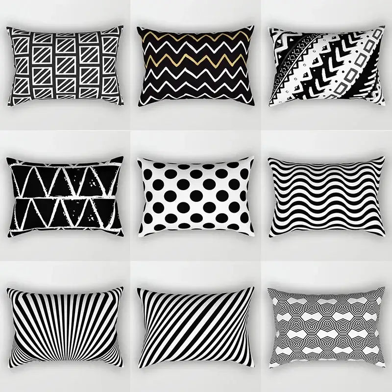 Nine black and white rectangular throw pillows with geometric wave line patterns arranged in a grid for bedroom decor