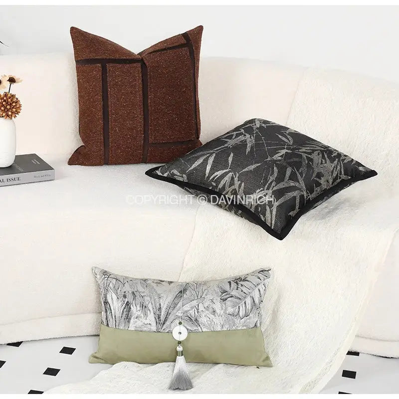 Brown textured throw pillow with dark brown geometric trim complements green jungle plants pillow cover for living room suede