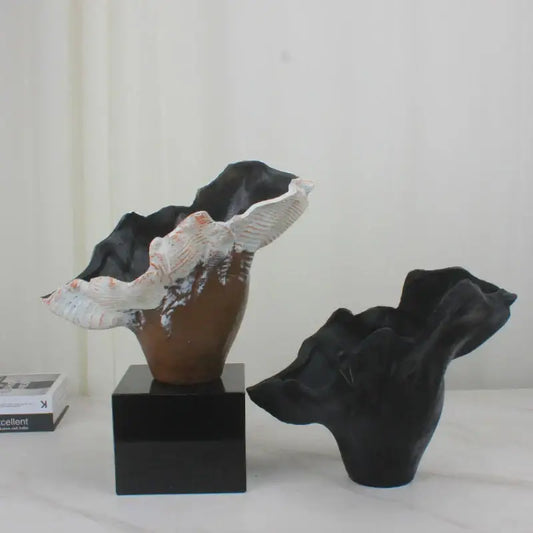 Black and white irregular resin flower vase sculpture with brown base on black pedestal for decorbites irregular resin decor