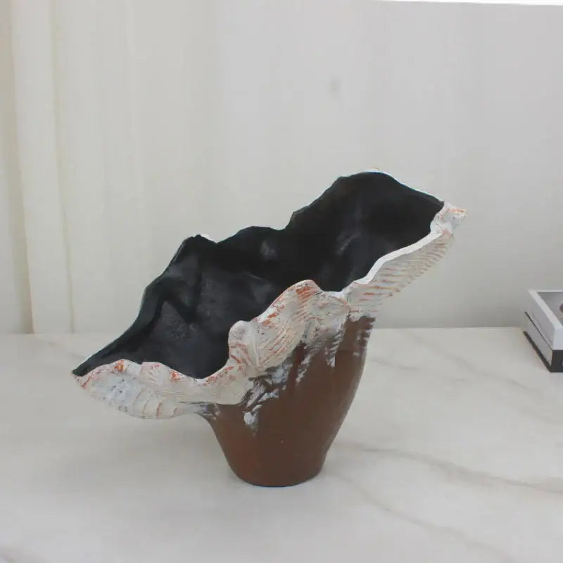 A brown ceramic resin flower vase with irregular leaf rim and white orange glaze accents for decorbites irregular resin decor